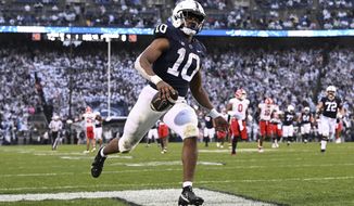 Penn State running back Nicholas Singleton (10) scores a touchdown against Maryland during the first half of an NCAA college football game, Saturday, Nov. 12, 2022, in State College, Pa. (AP Photo/Barry Reeger)