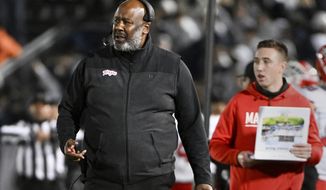 Maryland head coach Mike Locksley walks the sideline during the second half of an NCAA college football game against Penn State, Saturday, Nov. 12, 2022, in State College, Pa. (AP Photo/Barry Reeger)
