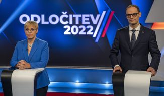 Liberal candidate Natasa Pirc Musar, left, and former Foreign Minister Anze Logar attend a TV debate in Ljubljana, Slovenia, Friday, Nov. 11, 2022. Run-off for the Slovenian presidential election is scheduled for Sunday, Nov. 13. (AP Photo/Darko Bandic)