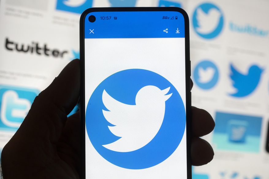 The Twitter logo is seen on a cellphone, Friday, Oct. 14, 2022, in Boston. (AP Photo/Michael Dwyer, File)