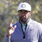 Tony Finau waves to the gallery as they cheer his birdie on the ninth hole during the final round of the Houston Open golf tournament Sunday, Nov. 13, 2022, in Houston. (AP Photo/Michael Wyke)