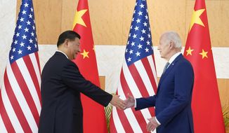 U.S. President Joe Biden, right, shakes hands with Chinese President Xi Jinping before their meeting on the sidelines of the G20 summit meeting, Monday, Nov. 14, 2022, in Nusa Dua, in Bali, Indonesia. (AP Photo/Alex Brandon)