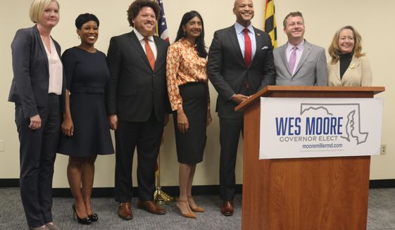 Maryland Gov.-elect Wes Moore, third from right, stands with key members of his administration&#39;s leadership team, which he announced during a news conference on Monday, Nov. 14, 2022 in Annapolis, Md. (AP Photo/Brian Witte)