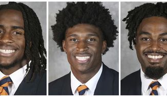 This combo of undated image provided by University of Virginia Athletics shows NCAA college football players, from left, Devin Chandler, Lavel Davis Jr. and D&#x27;Sean Perry. The three Virginia football players were killed in a shooting, Sunday, Nov. 13, 2022, in Charlottesville, Va., while returning from a class trip to see a play. (University of Virginia Athletics via AP)