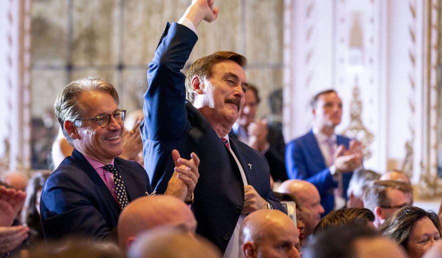 My Pillow CEO Mike Lindell pumps his fist in the air as former President Donald Trump announces he is running for president for the third time as he speaks at Mar-a-Lago in Palm Beach, Fla., Tuesday, Nov. 15, 2022. (AP Photo/Andrew Harnik)