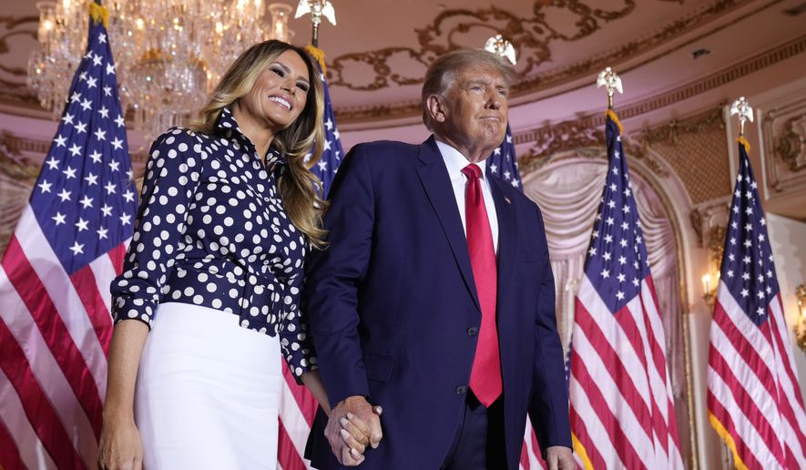 Former President Donald Trump stands on stage with former first lady Melania Trump after he announced a run for president for the third time at Mar-a-Lago in Palm Beach, Fla., Tuesday, Nov. 15, 2022. (AP Photo/Andrew Harnik)