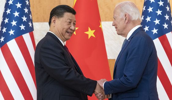 U.S. President Joe Biden, right, and Chinese President Xi Jinping shake hands before a meeting on the sidelines of the G20 summit meeting on Nov. 14, 2022, in Bali, Indonesia. Worries over North Korea were also mentioned in high-profile talks between Biden and Chinese leader Xi Jinping in Bali, according to the U.S. president. (AP Photo/Alex Brandon, File)