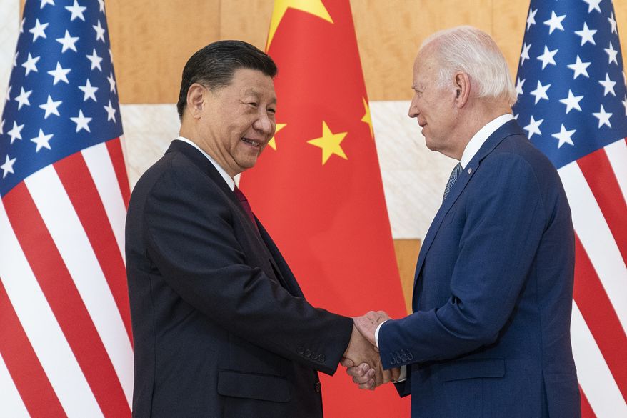 U.S. President Joe Biden, right, and Chinese President Xi Jinping shake hands before a meeting on the sidelines of the G20 summit meeting on Nov. 14, 2022, in Bali, Indonesia. Worries over North Korea were also mentioned in high-profile talks between Biden and Chinese leader Xi Jinping in Bali, according to the U.S. president. (AP Photo/Alex Brandon, File)