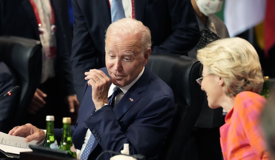 U.S. President Joe Biden talks with European Commission President Ursula von der Leyen before she co-hosts the Partnership for Global Infrastructure and Investment at the G20 summit meeting, Tuesday, Nov. 15, 2022, in Nusa Dua, Bali, Indonesia. (AP Photo/Alex Brandon)