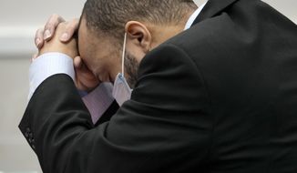 Darrell Brooks reacts as the guilty verdict is read during his trial in a Waukesha County Circuit Court in Waukesha, Wis., on Wednesday, Oct. 26, 2022. Dozens of people are expected to speak at sentencing proceedings for Brooks, who is convicted of killing six people when he drove his SUV through a Christmas parade in suburban Milwaukee last year. He will face six mandatory life terms when Judge Jennifer Dorow sentences him on Wednesday. Dorow set aside Tuesday for victims and their families to address Brooks, marking the first time they will be allowed to confront him. (Mike De Sisti/Milwaukee Journal-Sentinel via AP, Pool)