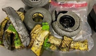 This photo provided by U. S. Customs and Border Protection shows cocaine seized by customs officers from a traveler who was smuggling the drugs in the wheels of her wheelchair at New York&#39;s Kennedy International Airport. The bust happened Nov. 10, 2022, when Customs and Border Patrol officers stopped a woman traveling from Punta Cana in the Dominican Republic with a wheelchair whose wheels weren&#39;t turning, the agency said in a news release.  (U. S. Customs and Border Protection via AP)