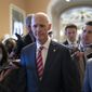 Sen. Rick Scott, R-Fla., who led the Senate Republican campaign arm this year, is surrounded by reporters as he arrives at the historic Old Senate Chamber where he is mounting a long-shot bid to unseat Senate Republican leader Mitch McConnell, at the Capitol in Washington, Wednesday, Nov. 16, 2022. (AP Photo/J. Scott Applewhite)