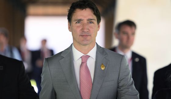 Canadian Prime Minister Justin Trudeau arrives ahead of an emergency meeting of leaders at the G-20 summit in Nusa Dua, Bali, Indonesia Wednesday, Nov. 16, 2022, following a missile explosion in Poland. (Leon Neal/Pool Photo via AP)