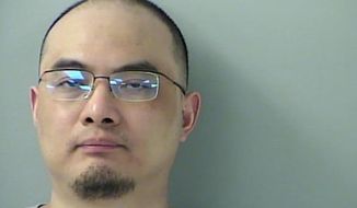 This photo provided by Butler County, Ohio, jail shows Yanjun Xu.  A federal judge is preparing to sentence Yanjun Xu, a Chinese national convicted of trying to steal trade secrets from U.S. aviation and aerospace companies. Prosecutors allege that beginning in 2013, Yanjun Xu recruited experts who worked at aviation companies, including GE Aviation.  The government is asking for a 25-year prison term at Wednesday, Nov. 16, 2022 sentencing hearing in Cincinnati. Xu&#39;s attorneys say a fair sentence would be the nearly five years he&#39;s served since his arrest.  ( Butler County, Ohio, jail via AP)