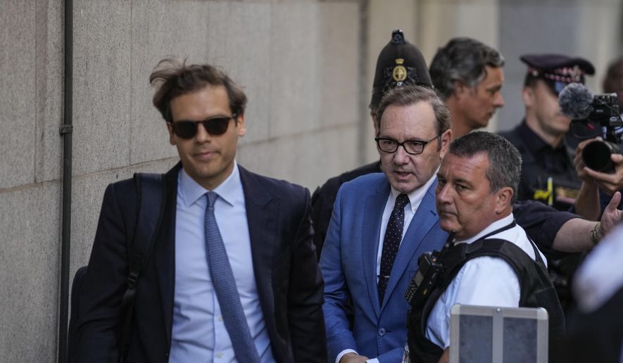 Actor Kevin Spacey, center, arrives at the Old Bailey, in London, Thursday, July 14, 2022. Actor Kevin Spacey will be charged with seven further sex offenses, all against one man, Britain’s Crown Prosecution said Wednesday, Nov. 16, 2022. (AP Photo/Frank Augstein, File)