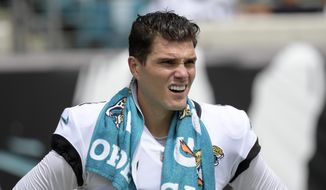 Jacksonville Jaguars place kicker Josh Lambo (4) watches from the sideline during the first half of an NFL football game against the Denver Broncos, Sept. 19, 2021, in Jacksonville, Fla. A judge has dismissed Lambo&#39;s lawsuit against the Jacksonville Jaguars in which he sought back pay and damages for emotional distress caused by former head coach Urban Meyer. Judge Gilbert Feltel Jr., of the Florida 4th Circuit Court in Duval County, dismissed the suit without prejudice on Nov. 8. He gave Lambo 21 days to amend and refile the complaint. Lambo&#39;s attorney, Betsy Brown, said Wednesday, Nov. 16, 2022 she intends to do so. (AP Photo/Phelan M. Ebenhack)