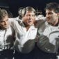 Miami coach Jimmy Johnson, center, is hugged by his sons, Chad, left, and Brent, rightk, while walking off the field following the team&#39;s win over Nebraska in the Orange Bowl college football game in Miami, Jan. 2, 1989. Johnson won two Super Bowls as coach of the Dallas Cowboys and a national championship at Miami. In his view, Johnson’s biggest success has nothing to do with football. The 79-year-old Johnson describes in “Swagger,” his memoir that released on Tuesday, how his addiction to football and winning caused him to never have a family dinner. His two sons played football but Dad never saw them play a full game.  (AP Photo/Chris O&#39;Meara, File)