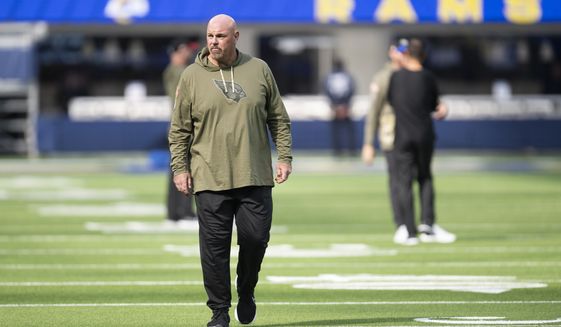 Arizona Cardinals offensive line coach Sean Kugler walks on the field before an NFL football game against the Los Angeles Rams, Sunday, Nov. 13, 2022, in Inglewood, Calif. (AP Photo/Kyusung Gong)