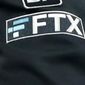The FTX logo appears on home plate umpire Jansen Visconti&#x27;s jacket at a baseball game with the Minnesota Twins on Tuesday, Sept. 27, 2022, in Minneapolis. (AP Photo/Bruce Kluckhohn, File)