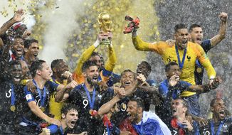 France goalkeeper Hugo Lloris lifts the trophy after France won 4-2 during the final match between France and Croatia at the 2018 soccer World Cup in the Luzhniki Stadium in Moscow, Russia, Sunday, July 15, 2018. (AP Photo/Martin Meissner) **FILE**