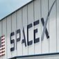 The SpaceX logo is displayed on a building, Tuesday, May 26, 2020, at the Kennedy Space Center in Cape Canaveral, Fla.  Several SpaceX employees who were fired after circulating an open letter calling out CEO Elon Musk’s behavior have filed a complaint accusing the company of violating labor laws. The complaint, made Wednesday, Nov. 16, 2022, to the National Labor Relations Board, says five employees who participated in organizing the June letter were fired a day after the letter was sent to company executives. (AP Photo/David J. Phillip, File)