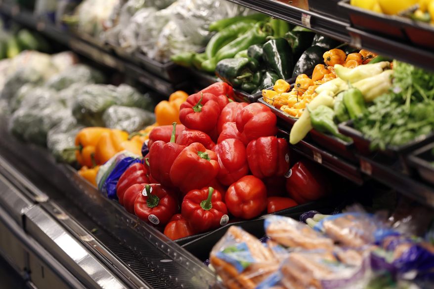 FILE - Vegetables are displayed for sale at a grocery store in River Ridge, La., Wednesday, July 11, 2018. On Thursday, Nov. 17, 2022, U.S. agriculture officials proposed changes to the federal program that helps pay the grocery bills for pregnant women, babies and young children that includes keeping a bump in payments for fresh fruits and vegetables allowed during the COVID-19 pandemic. (AP Photo/Gerald Herbert, File)