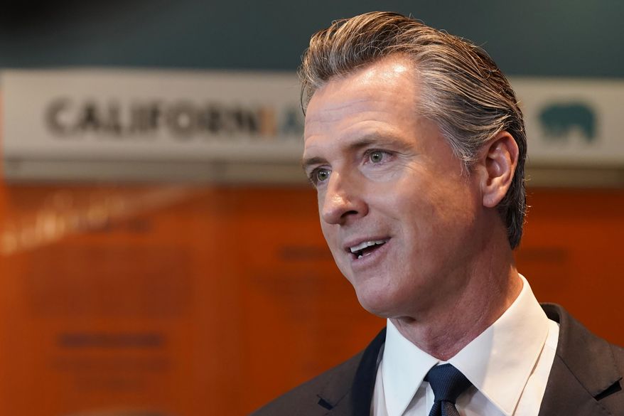 California Gov. Gavin Newsom talks to reporters after voting in Sacramento, Calif., Tuesday, Nov. 8, 2022. Newsom has agreed to release $1 billion in state homelessness funding he testily put on pause earlier this month. But his office says he will do so only if local governments agree to step up the aggressiveness of their plans going forward to reduce homelessness. (AP Photo/Rich Pedroncelli,File)