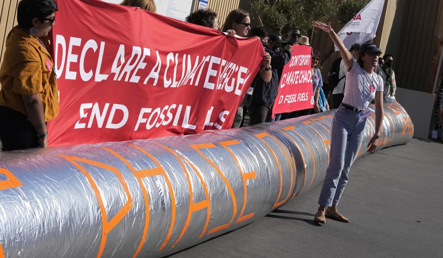 Lauren Latour, of Canada, participates in a demonstration on fossil fuels at the COP27 U.N. Climate Summit, Friday, Nov. 18, 2022, in Sharm el-Sheikh, Egypt. (AP Photo/Peter Dejong)