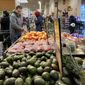 Shoppers pick out items at a grocery store in Glenview, Ill., Saturday, Nov. 19, 2022. On Wednesday the Commerce Department issues its second of three estimates of how the U.S. economy performed in the second quarter of 2022. (AP Photo/Nam Y. Huh, File)
