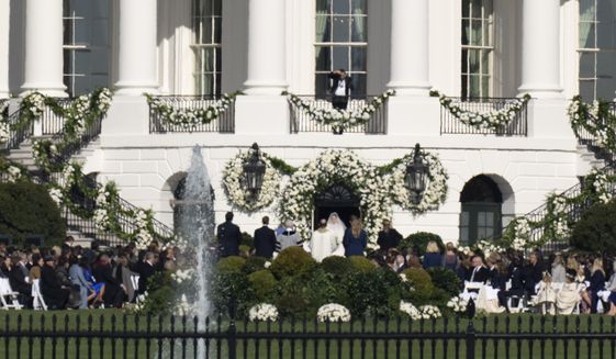 President Joe Biden&#39;s granddaughter Naomi Biden and her fiance, Peter Neal, are married on the South Lawn of the White House in Washington, Saturday, Nov. 19, 2022. (AP Photo/Carolyn Kaster)