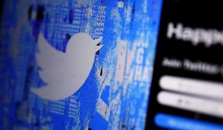 The Twitter splash page is seen on a digital device, Monday, April 25, 2022, in San Diego. (AP Photo/Gregory Bull, File)
