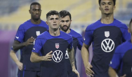United States forward Christian Pulisic, center, and other players participate in an official training session at Al-Gharafa SC Stadium, in Doha, Saturday, Nov. 19, 2022. (AP Photo/Ashley Landis)