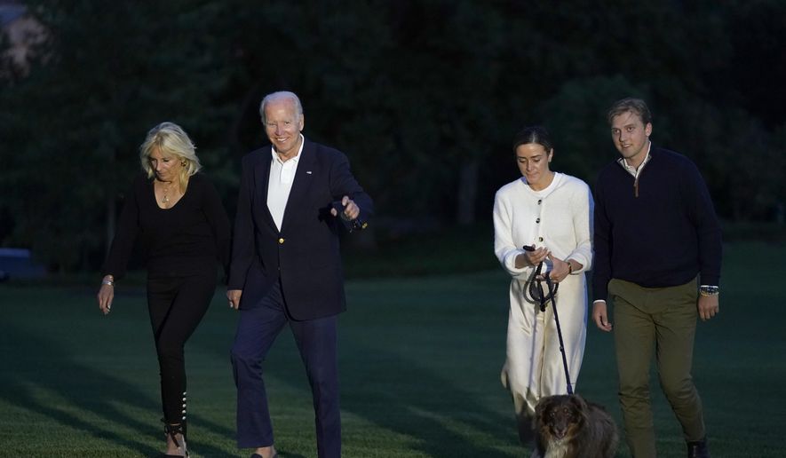 President Joe Biden and fist lady Jill Biden, left, walk with their granddaughter Naomi Biden, second from right, and her fiancé Peter Neal, right, and Neal&#39;s dog Charlie, across the South Lawn of the White House in Washington, June 20, 2022, as they return from a weekend at the Biden&#39;s beach home in Delaware. Naomi Biden and Peter Neal are getting married on the South Lawn on Saturday in what will be the 19th wedding in White House history. (AP Photo/Susan Walsh, File)