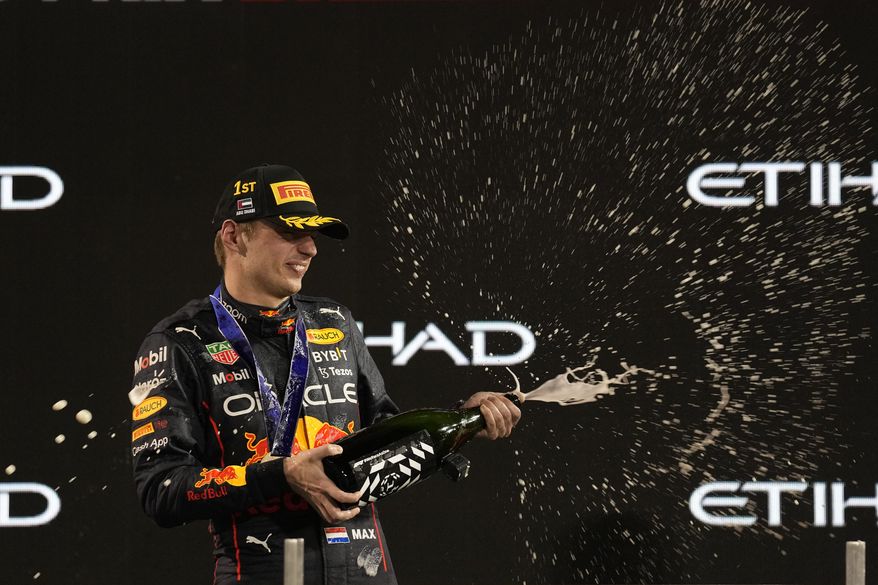 Red Bull driver Max Verstappen of the Netherlands celebrates after he won the Formula One Abu Dhabi Grand Prix, in Abu Dhabi, United Arab Emirates Sunday, Nov.20, 2022. (AP Photo/Kamran Jebreili)