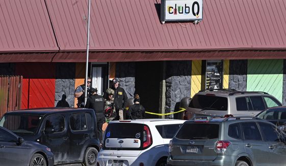 Colorado Springs police, the FBI and others investigate the scene of a shooting at Club Q on Sunday, Nov. 20, 2022 in Colorado Springs, Colo. An attacker opened fire in a gay nightclub late Saturday night. (Helen H. Richardson/The Denver Post via AP)