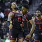 Houston guard Terrance Arceneaux (23) celebrates his 3-point shot against Oregon with forward J&#39;Wan Roberts (13) and Houston guard Jamal Shead (1) during the first half of an NCAA college basketball game Sunday, Nov. 20, 2022, in Eugene, Ore. (AP Photo/Andy Nelson) **FILE**