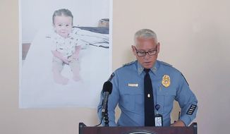 Chatham County Police Chief Jeff Hadley speaks to reporters as he stands in front of a large photo of missing toddler Quinton Simon at a police operations center being used in the search for the boy&#39;s remains just outside Savannah, Ga., on Oct. 18, 2022. Quinton&#39;s mother has been arrested in connection with the child&#39;s disappearance and presumed death, authorities said Monday, Nov. 21. (WSAV-TV via AP, File)