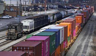 This April 2, 2021, file photo shows freight train cars and containers at Norfolk Southern Railroad&#x27;s Conway Yard in Conway, Pa. Railroad engineers accepted their deal with the railroads that will deliver 24% raises, but conductors rejected the contract casting more doubt on whether the industry will be able to resolve the labor dispute before next month’s deadline without Congress’ help. The votes, Monday, Nov. 21, 2022, by the two biggest railroad unions follow the decision by three other unions to reject their deals with the railroads that the Biden administration helped broker before the original strike deadline in September. (AP Photo/Gene J. Puskar, File)
