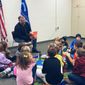 The Rev. Michael Foster of East River Church in Batavia, Ohio, reads from “The King and the Dragon” to children at the local Clermont County Public Library branch. Photo courtesy of Michael Foster; used with permission.