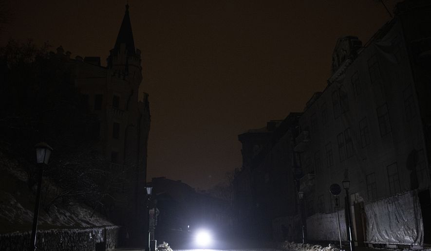 This photo shows a city center during a blackout after a Russian rocket attack in Kyiv, Ukraine, Wednesday, Nov. 23, 2022. Russia unleashed a new missile onslaught on Ukraine&#39;s battered energy grid Wednesday, robbing cities of power and some of water and public transport, too, compounding the hardship of winter for millions. The aerial mauling of power supplies also took nuclear plants and internet links offline and spilled blackouts into neighbor Moldova. (AP Photo/Andrew Kravchenko)