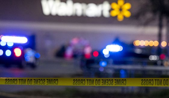 Police tape cordons off the scene of a fatal shooting at a Chesapeake, Va., Walmart Tuesday, Nov. 22, 2022. (Kendall Warner/The Virginian-Pilot via AP)