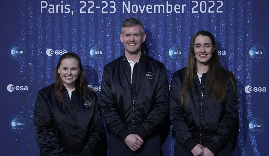 ESA&#39;s new parastronaut John McFall, a British former Paralympic sprinter who will take part in a potentially groundbreaking feasibility study to explore whether physical disability will impair space travel, poses with ESA&#39;s new astronauts Meganne Christian, left, and Rosemary Coogan, right, during the ESA Council at Ministerial level (CM22) at the Grand Palais Ephemere, in Paris, Wednesday, Nov. 23, 2022. The European Space Agency has selected a disabled former athlete to be among its its newest astronaut recruits as part of its first recruitment drive in over a decade that aimed to bring diversity to space travel. (AP Photo/Francois Mori)