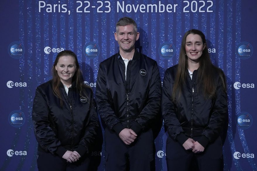 ESA&#x27;s new parastronaut John McFall, a British former Paralympic sprinter who will take part in a potentially groundbreaking feasibility study to explore whether physical disability will impair space travel, poses with ESA&#x27;s new astronauts Meganne Christian, left, and Rosemary Coogan, right, during the ESA Council at Ministerial level (CM22) at the Grand Palais Ephemere, in Paris, Wednesday, Nov. 23, 2022. The European Space Agency has selected a disabled former athlete to be among its its newest astronaut recruits as part of its first recruitment drive in over a decade that aimed to bring diversity to space travel. (AP Photo/Francois Mori)