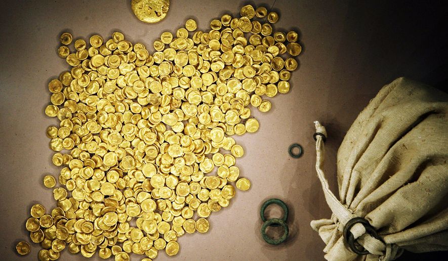 Coins of the Celtic Treasure are on display at the local Celtic and Roman Museum in Manching, Germany, May 31, 2006. A senior official said Wednesday that organized crime groups were likely behind the theft of a huge horde of ancient gold coins stolen from a museum in southern Germany this week. (Frank Maechler/dpa via AP, file)