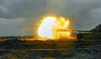 Ukrainian army fires a captured Russian tank T-80 at the Russian position in Donetsk region, Ukraine, Tuesday, Nov. 22, 2022. (AP Photo/LIBKOS)