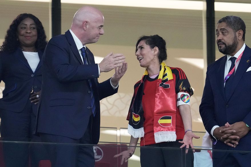 Belgium Foreign Minister Hadja Lahbib, wearing a &amp;quot;One Love&amp;quot; armband, talks with FIFA President Gianni Infantino, left, on the tribune during the World Cup group F soccer match between Belgium and Canada, at the Ahmad Bin Ali Stadium in Doha, Qatar, Wednesday, Nov. 23, 2022. (AP Photo/Natacha Pisarenko)