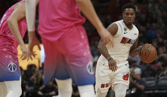 Miami Heat guard Kyle Lowry brings the ball up the court against the Washington Wizards during the first half of an NBA basketball game, Wednesday, Nov. 23, 2022, in Miami. (AP Photo/Jim Rassol)