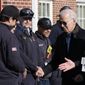 President Joe Biden presents a challenge point to Nantucket Fire Department Captain Nate Barber, second from left, during a visit to the Nantucket Fire Department on Thanksgiving Day in Nantucket, Mass., Thursday, Nov. 24, 2022. (AP Photo/Susan Walsh)