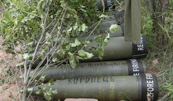 U.S.-supplied M777 howitzer shells lie on the ground to fire at Russian positions in Ukraine&#39;s eastern Donbas region June 18, 2022. The intense firefight over Ukraine has the Pentagon rethinking its weapons stockpiles. If another major war broke out today, would the U.S. have enough ammunition to fight? It’s a question Pentagon planners are grappling with not only as the look to supply Ukraine for a war that could stretch for years, but also as they look to a potential conflict with China. (AP Photo/Efrem Lukatsky, File)