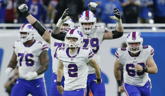 Teammates react after Buffalo Bills place kicker Tyler Bass (2) kicked a 45-yard game winning field goal in the closing seconds of an NFL football game against the Detroit Lions, Thursday, Nov. 24, 2022, in Detroit. (AP Photo/Duane Burleson)